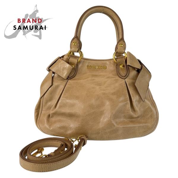 miu miu（ミュウミュウ） 美品 リボン ベージュ ゴールド金具 レザー