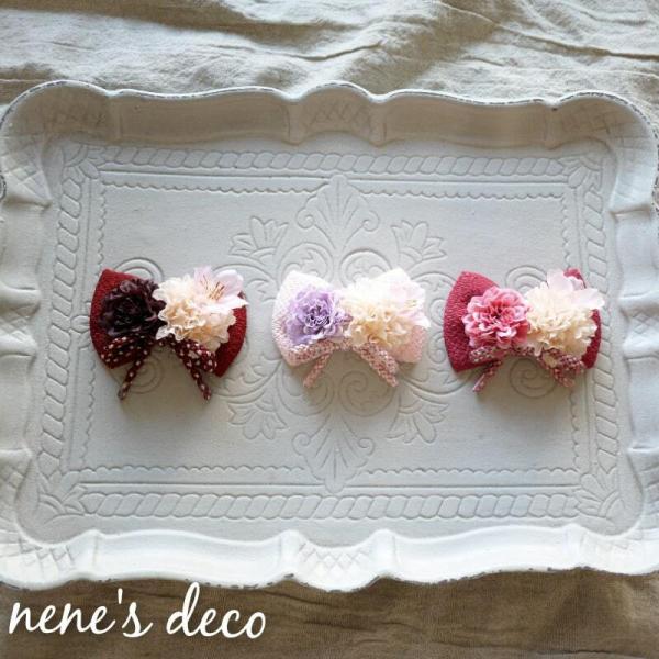 組紐とちりめんりぼんのベビー髪飾り。赤ちゃんのお食い初めや初節句に可愛い和ヘアアクセサリー。袴ロンパースやお着物に合わせやすい和リボン。新生児にも安心ヘアバンドです。リボンモチーフ全長：6.5ｃｍ※着用画像は違う商品ですが、リボン部分のサイ...