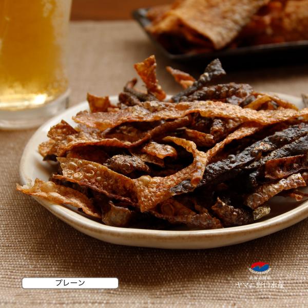 北海道産 鮭皮100%使用。 サクッと軽い鮭の味。 旨味たっぷり鮭皮を独自の技術でノンフライチップスにしました。原材料名:鮭皮（北海道産）、食塩、砂糖、たんぱく加水分解物/ソルビット、調味料（アミノ酸等）、くん液、紅麹色素、pH調整剤、（一...