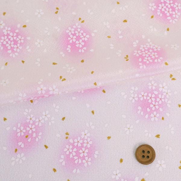 ■レーヨン100% ■約70cm幅 ※ボタンは直径約2cm。10cm単位で販売、価格は10cm分です。数量は10cm単位で入力して下さい(例:1m購入なら数量10) ●春らしい印象の優しい桜柄のちりめん生地です。金彩の花びらと、染め上がった...