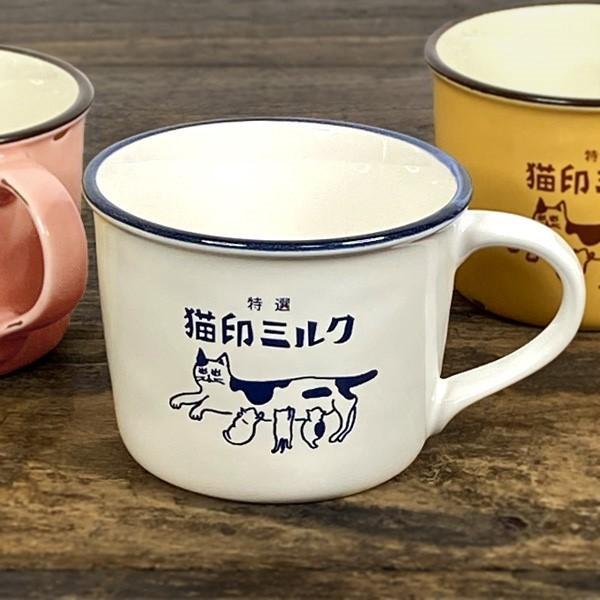 美濃焼の窯元の職人によってホーロー風に仕上げられた陶磁器製の猫柄マグカップです。牛柄の、つぶらな瞳の母猫と丸っこい子猫がかわいいです。ホワイトはミルクのような白色に上縁のブルーがアクセントに。イエローは完熟バナナや濃厚プリンのような、こっく...