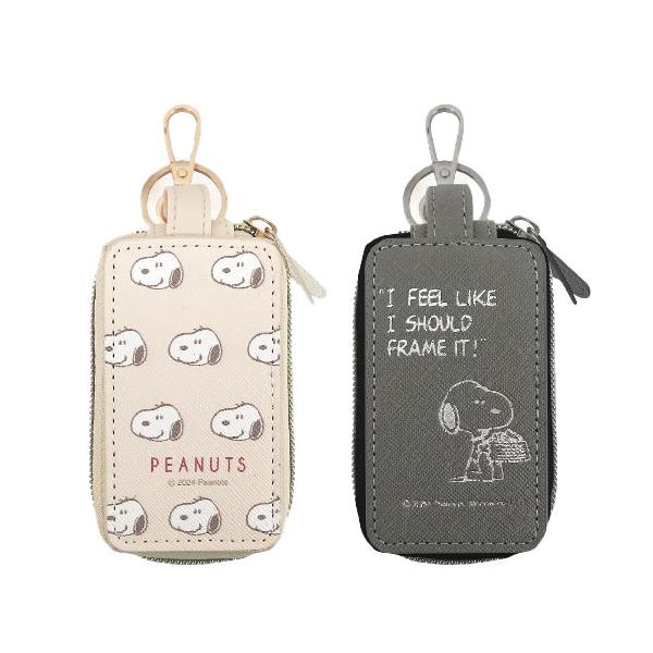 【送料無料】かわいいスヌーピーの車用スマートキーケースです。ポケットが2つに分かれているのでスマートキーと家の鍵を分けて収納。2つのポケットは大きく開き出し入れもスムーズ。本体裏面が透明ウィンドウになっているので、ケースにいれたままスマート...