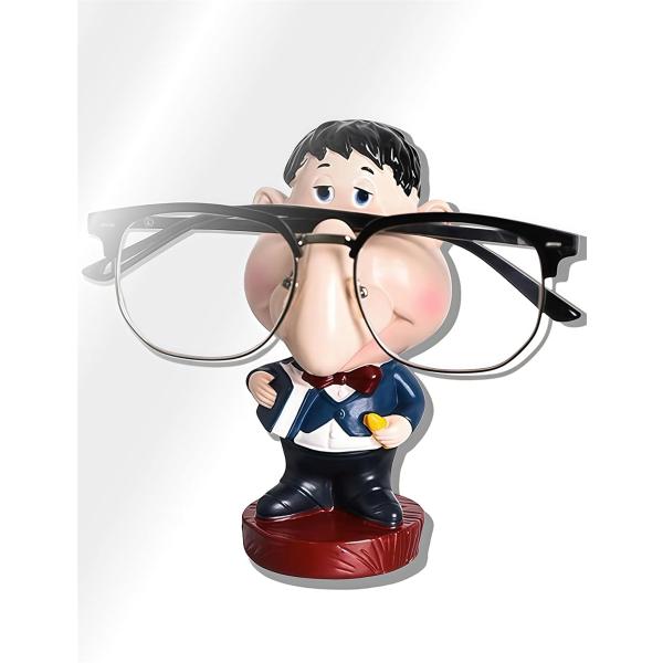 「サイズ」：奥行き8cmx横6cmx高さ13cm 「重さ」：約65g 「材質」：合成樹脂(生産国：中国) 「機能・用途」：メガネスタンド、眼鏡置き「ユニークなデザイン」：優しくコミカルで かわいい 垂れ目の せんせい があなたのメガネを顔で...