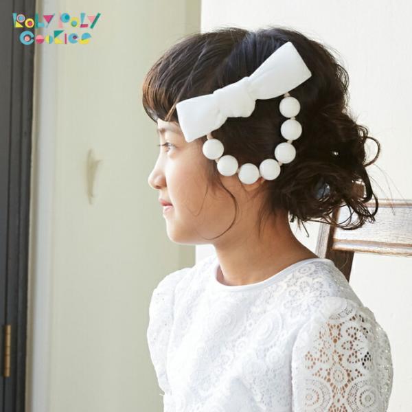 空き状況は「すべて見る」を押してチェック！大きめリボンと丸いビーズの可愛らしいヘアクリップです。とても軽い発泡ビーズなので、小さなお子様にも負担になりにくいです。毛量の少ないお子さまにも使いやすいクリップです。ハンドメイドの1点ものです。お...
