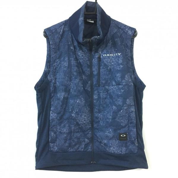 サイズ：XL OAKLEY オークリー  切替 中綿ジャケット 総柄 ブラック系 [240101414222] ゴルフウェア メンズ ストスト サイズ：XL OAKLEY オークリー 切替 中綿ジャケット 総柄