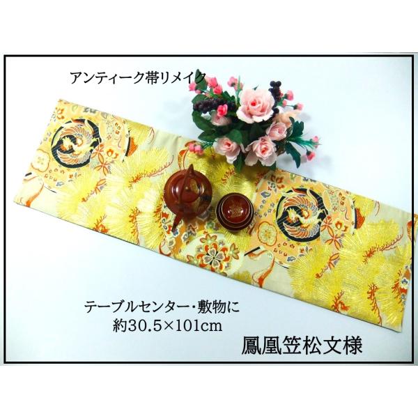 ■画像にある小物(ハンガーや花など)は商品に含まれません。◆大正昭和時代の100年前のアンティーク帯をリメイクしました。■サイズ---【cm】約　幅30.5長さ101■100年前の帯としては状態が良いですがキナリ色部分に薄染みがある物もごさ...