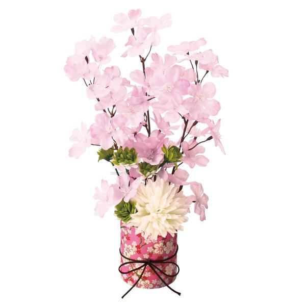 卓上の桜造花アレンジメント。シンプルで使いやすいデザインです。商品棚やレジカウンター、受付に飾って春らしい店舗ディスプレイに。●素材／ポリエステル・ポリスチレン・紙●サイズ／幅16×奥行9×高さ33cm ベース：直径7×高さ7.5cm