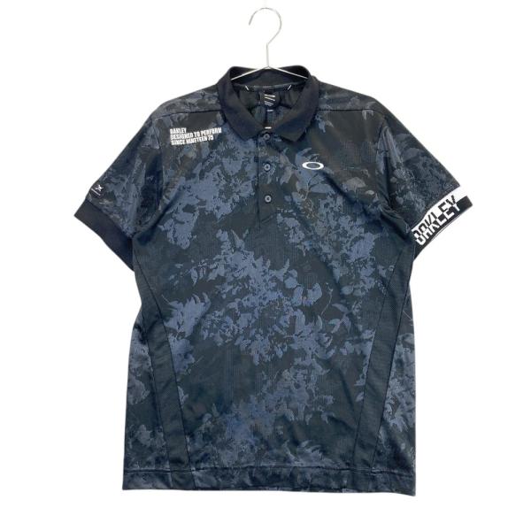 サイズ：L OAKLEY オークリー  半袖ポロシャツ 総柄 ブラック系 [240101369942] ゴルフウェア メンズ ストスト OAKLEY オークリー 半袖ポロシャツ 総柄 ブラック系 L ゴルフ