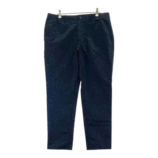サイズ：XL TRAVIS MATHEW トラビスマシュー  ロングパンツ 総柄 ブラック系 [240101449544] ゴルフウェア メンズ ストスト TRAVIS MATHEW トラビスマシュー ロングパンツ 総柄 ブラック系