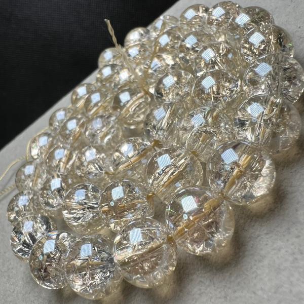 1連 40cm  38-39粒ブレスレットを2本作れます。天然による結晶や割れ目があり場合があります。天然石穴サイズ:0.8mm シャンパンオーラは天然色ではありません。特殊メッキ―加工による着色です。結晶、破裂のような模様、凹みのようなも...