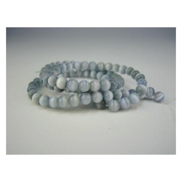 【連売り商品】キャッツアイ（人工石）パウダーブルー☆商品情報☆石サイズ：約Φ4.2±0.2mm粒数：約95±1粒全長：約38±0.5cm　穴サイズ：約0.8mm※天然キャッツアイではありません。※連売りのため色やサイズのばらつき、自然な割れ...