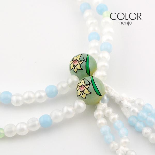 親玉に模様が入ったかわいらしい女性用念珠！−仕　様−■サイズ：女性用/８寸　(親玉から親玉までの幅：２５ｃｍ)■カラー：水色×ホワイト　　　　　ユリ模様入り■材　質：プラスチック房(ふさ)：綿ふさ(水色)【メール便(ポスト投函)対応商品】・...