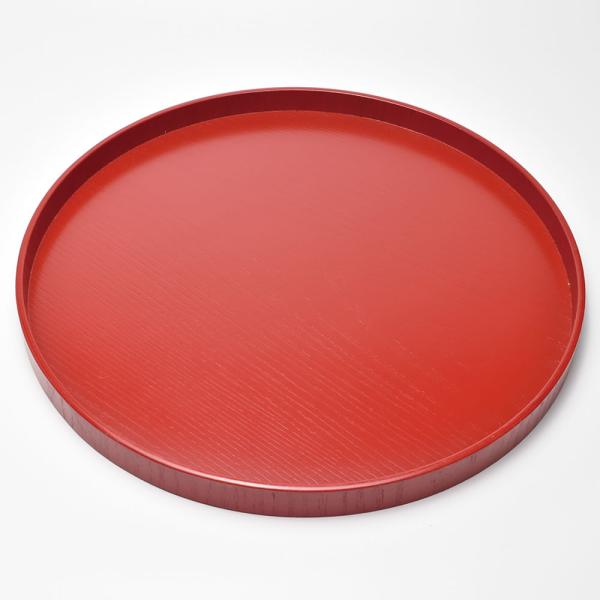 印象的な真っ赤な円いお盆です。