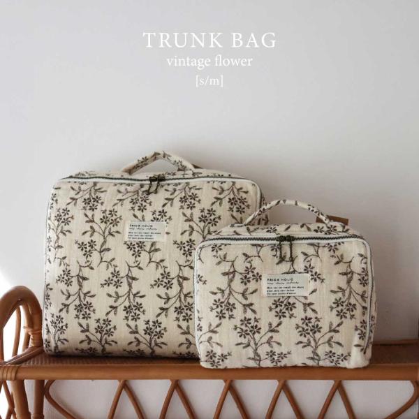 オリジナルTRICK HOLIC vintage flower trunk bagマチが薄く、かばんの中でかさばらないようシンプルなデザインで製作したマルチバッグ。持ち手部分の縫製もしっかりと補強し、内側も丁寧にパイピング処理をしました。さ...