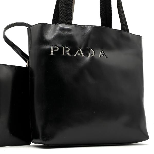 PRADA トートバッグ 肩掛け ロゴ入り カットワーク レザー 黒 男女可能 プラダ PRADA トートバッグ ハンドバッグ カットワーク ロゴ ブラック