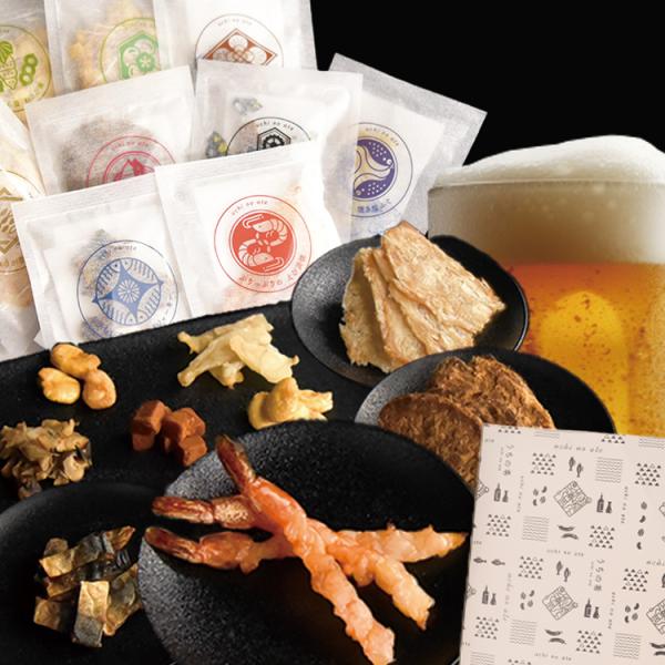 【商品番号】23129999502【商品名】ギフトセレクション9種【内容量】焼き塩ふぐ/7g、焼きうに/10g、えび浜焼/12g、ばい貝くんせい/13g、さばジャーキー/14g、かわはぎ生姜/14g、むきそら豆/50g、むきそら豆わさび味/...