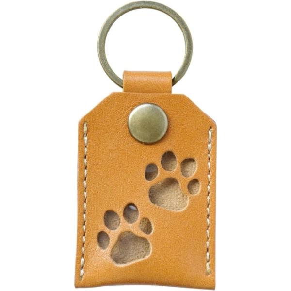 バリエーションコード : 2BU6O2829Cいつも一緒にいたい、その願いを叶える遺毛ケース：大切なペットの遺毛を、肌身離さず持ち歩けるキーホルダー。上質な本革と愛らしい肉球型の窓が、思い出を優しく包み込みます。細部までこだわった、確かな品...