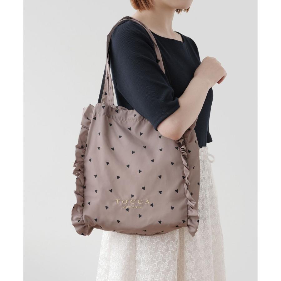 新品【TOCCA】DANCING LOVE FRILL SUBBAG サブバッグ 撥水】DANCING LOVE FRILL SUBBAG サブバッグ / TOCCA