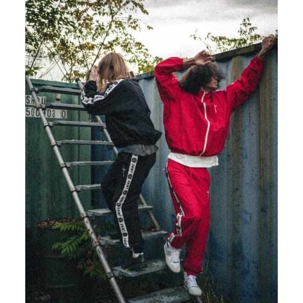 SAINT MICHAEL／セント マイケル／TRACK PANTS／SIDE TAPE／REDの画像