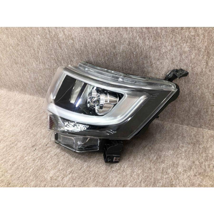 ムーヴ カスタム LA150S前期左ライトKOITO 100-69010