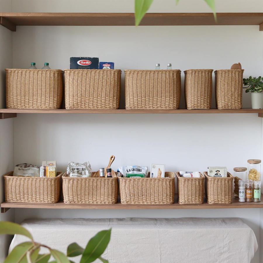 Natural woven baskets organized on wooden shelves for stylish home storage