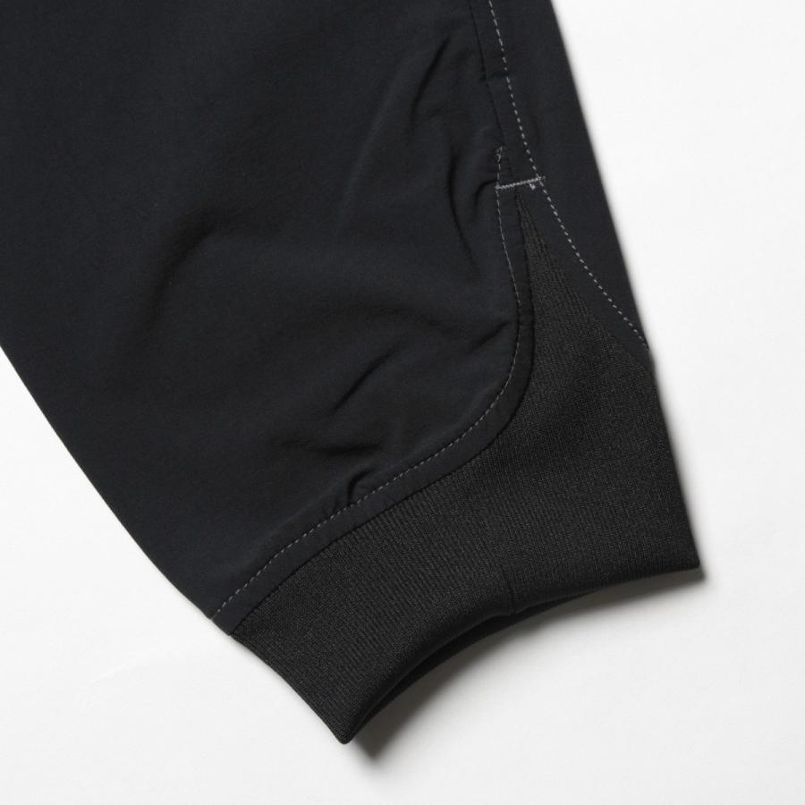 アンドワンダー シェラーストレッチサルエルパンツ*黒/0*and wander アンドワンダー シェラーストレッチサルエルパンツ*黒/0*and