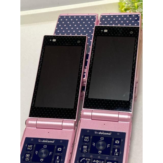 ドコモ　F06d　ガラケー　携帯電話　docomo STYLE series F-06D Girls' ☆ハッピーピンク☆ ガールズ　リボン　ドット　判定〇 中古｜acty0102｜06