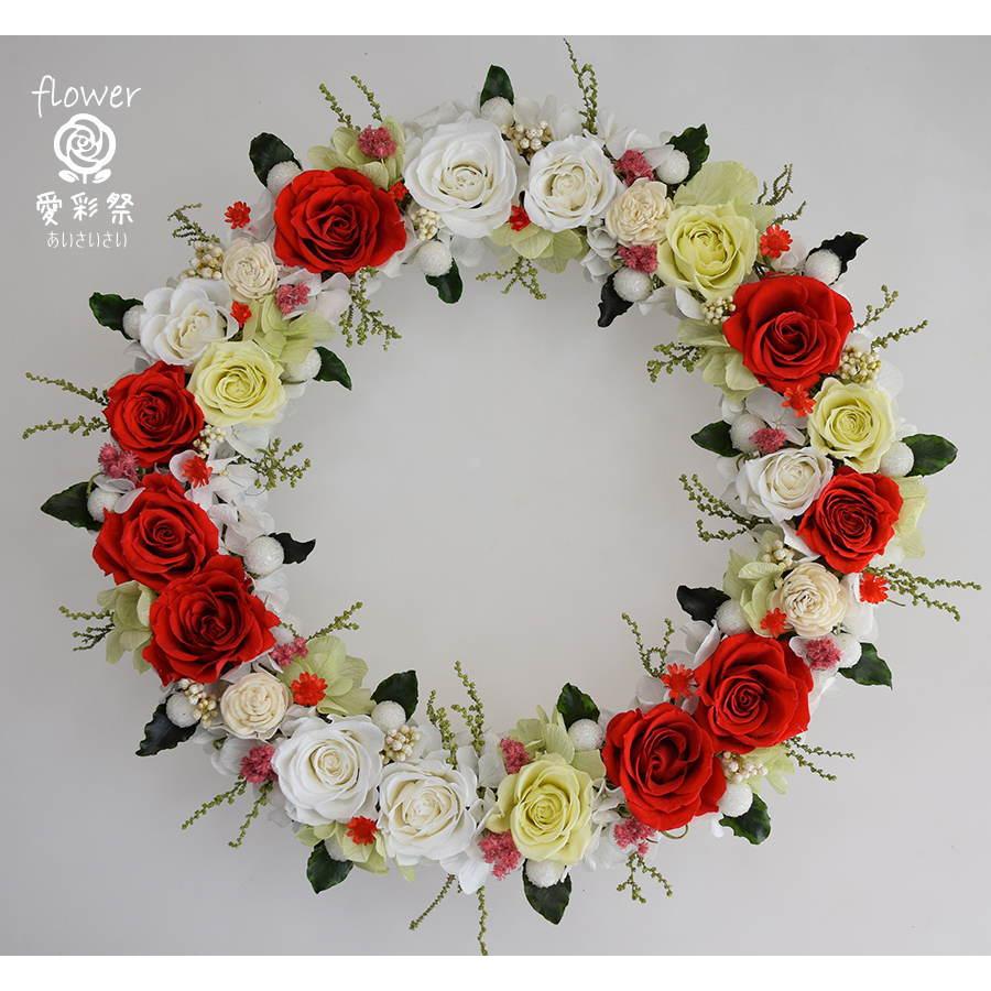 赤いバラと白いソーラーフラワー 周り葉をあしらったプリザーブド