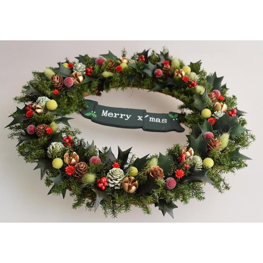 クリスマスリース Merry Christmasのプレート付き 玄関に ヒイラギの葉 赤い実 松ぼっくり ギフト プレゼント 誕生日 開店祝 引越し祝 Oxk25f 愛彩祭 フラワーリースのお店 通販 Yahoo ショッピング