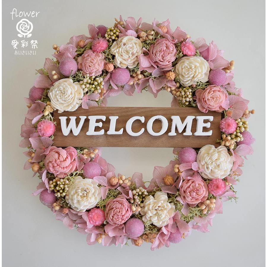 13周年記念イベントが 玄関ドアに 白とピンクのお花のかわいらしい色合いのウェルカムリース ギフト プレゼント 開店祝 引越し祝 誕生日