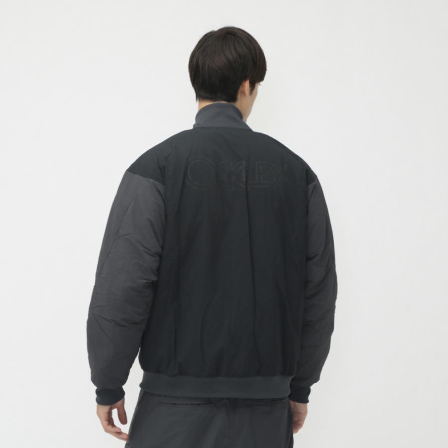 オークリー 日本ハムファイターズ 中綿 スタンドカラー ジャケット ブルゾン S OAKLEY オークリー メンズ 中綿ジャケット BORDERLESS VARSITY