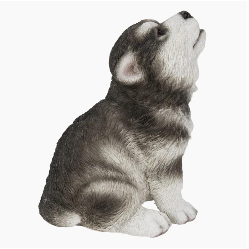 かわいい遠吠えのアラスカンマラミュートの子犬の本物そっくりの像