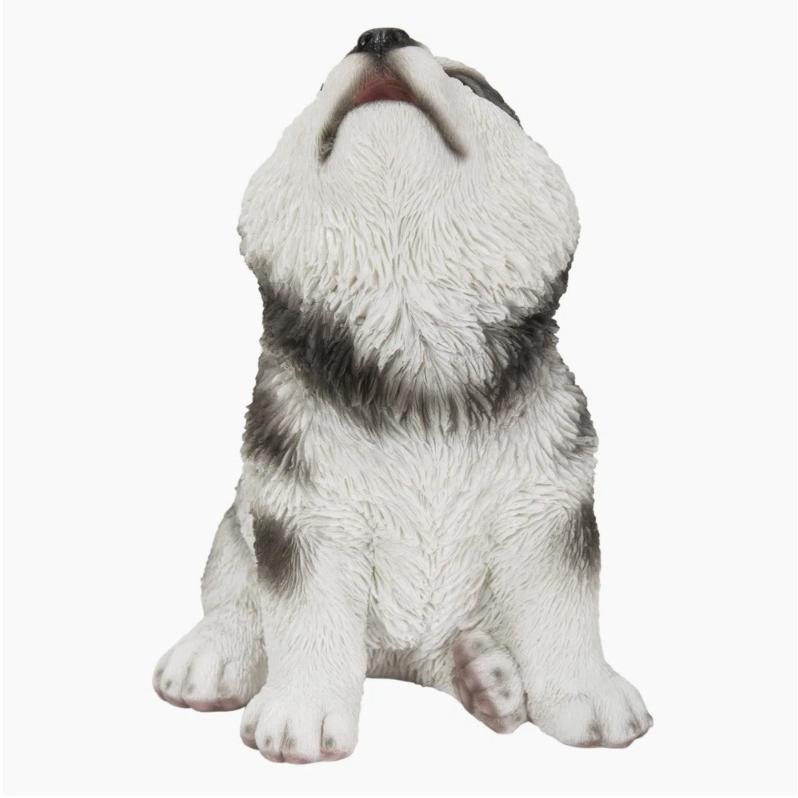 かわいい遠吠えのアラスカンマラミュートの子犬の本物そっくりの像
