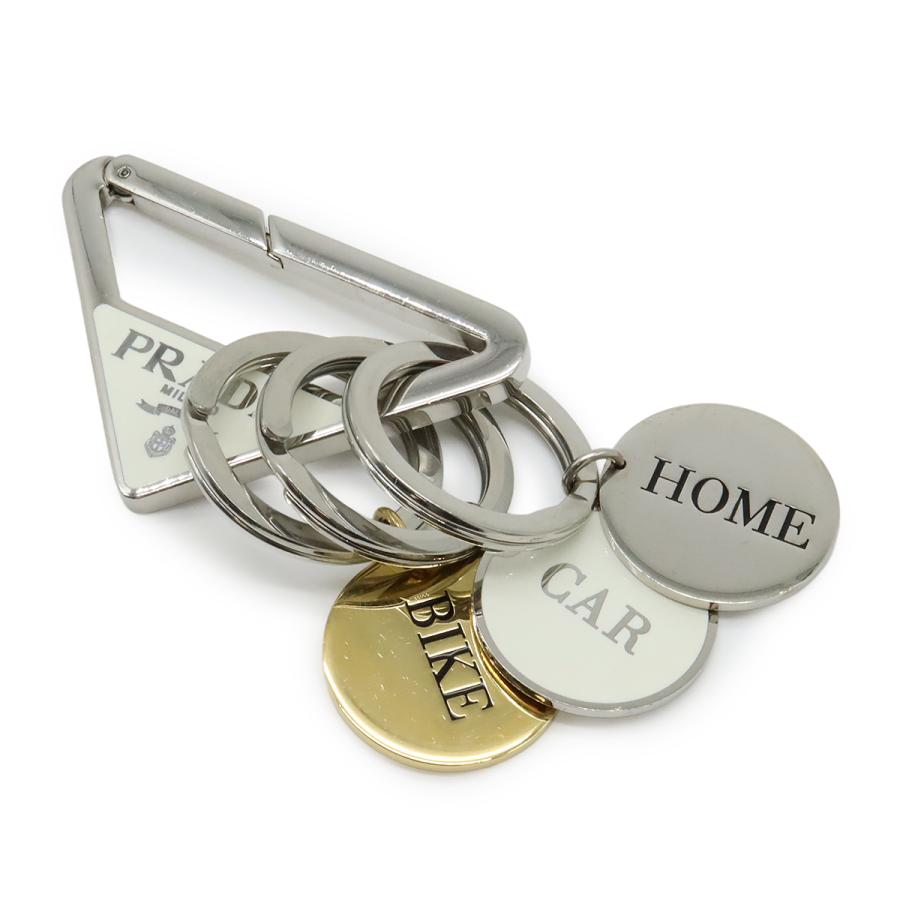 PRADA プラダ トライアングルロゴ キーホルダー キーリング バッグチャーム メタル ホワイト 白 シルバー金具 1PS058 | PRADA