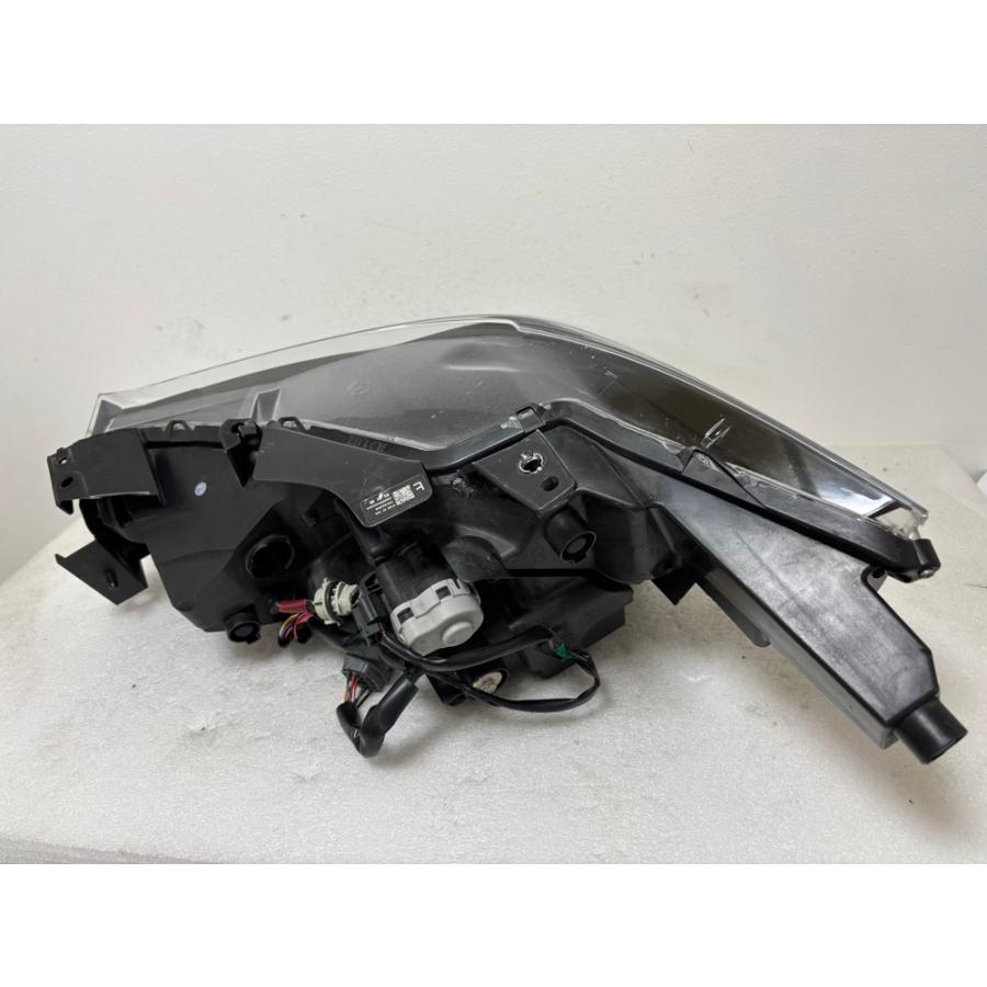 カローラアクシオ DBA-NZE141 左ヘッドライト コイト 81150