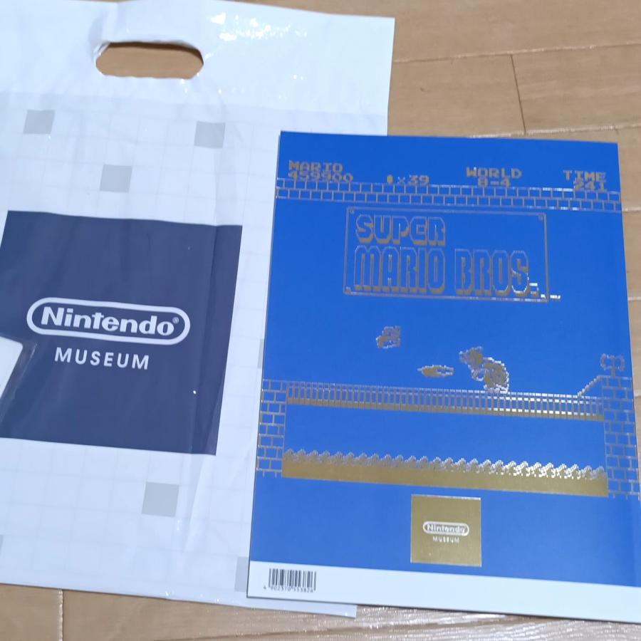 新品★任天堂ミュージアム公式ガイドブック Vol.01 日本語版★限定ポストカード2枚付/スーパーマリオブラザーズ40周年 /記念 /任天堂公式資料/限定品の画像