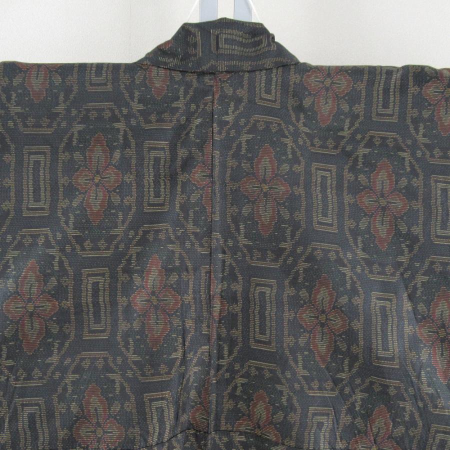 紬 着物 大島紬 幾何学模様に花 黒色ｘオレンジ色ｘ緑色 袷 広衿 正絹 仕立て上がり着物 身丈158cm |  | 02