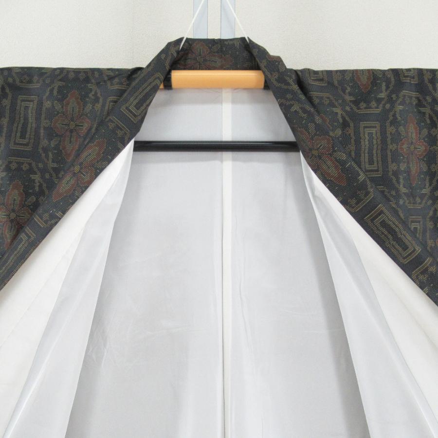 紬 着物 大島紬 幾何学模様に花 黒色ｘオレンジ色ｘ緑色 袷 広衿 正絹 仕立て上がり着物 身丈158cm |  | 06