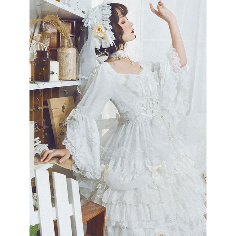 甘いロリータウェディングドレス白いボウノットフリルティー