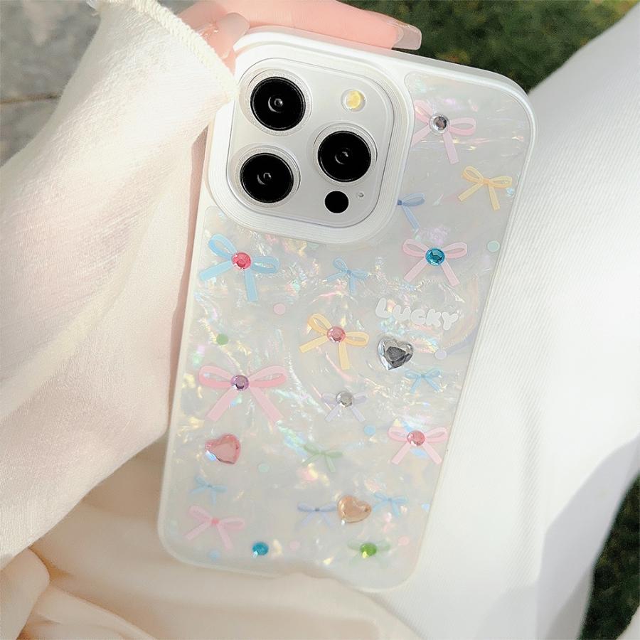 ピュアホワイトシェルカバービジューカラフルリボン宝石風キラキラ