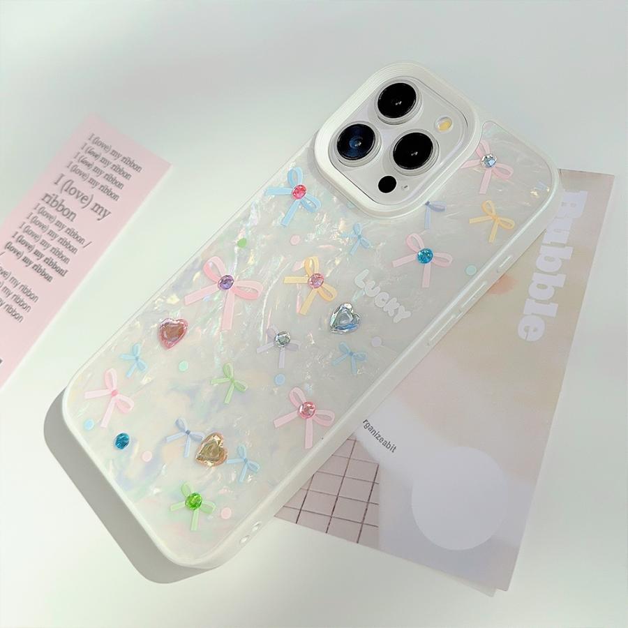 ピュアホワイトシェルカバービジューカラフルリボン宝石風キラキラ