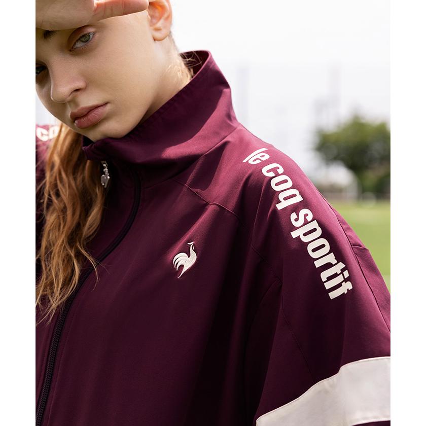 Le coq sportif 　透湿防水機能 裏メッシュ、肘と膝ジッパーで七分に le coq sportif（ルコックスポルティフ） 公式 裏メッシュ付きウィンド