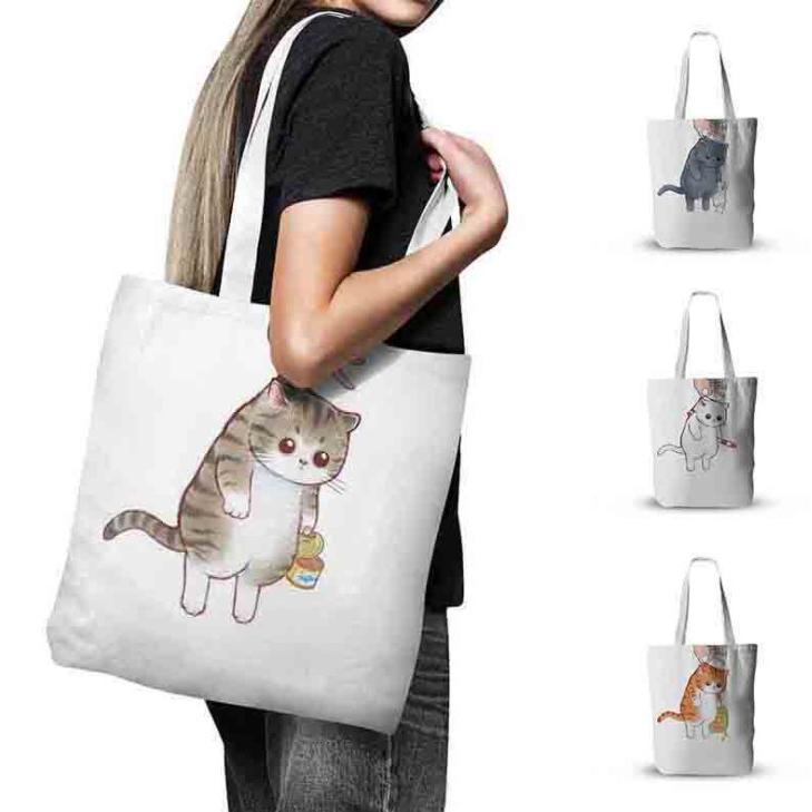つままれ猫のトートバッグ いたずらした現場をおさえられました 両面