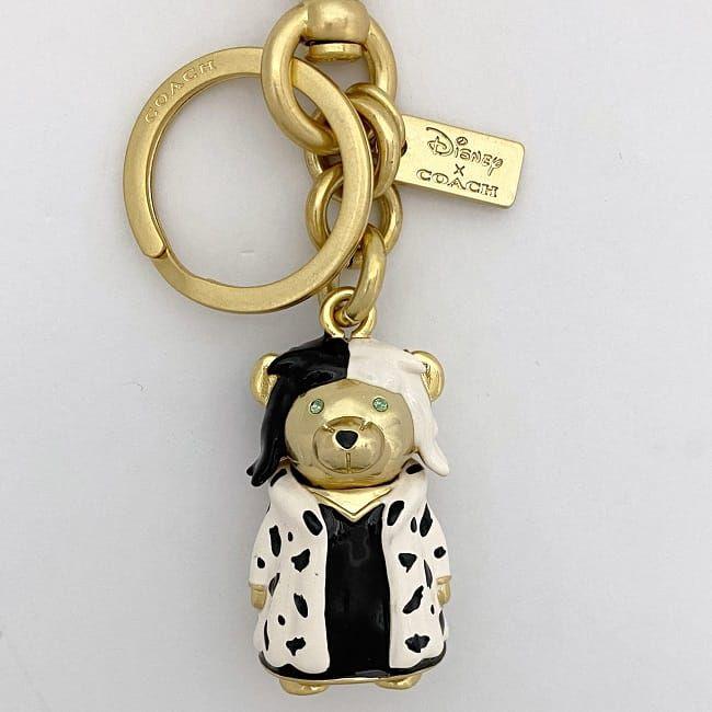 コーチ キーホルダー ゴールド ホワイト ブラック クルエラ Disney  