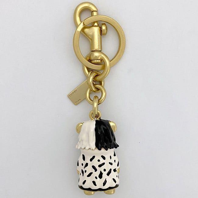 コーチ キーホルダー ゴールド ホワイト ブラック クルエラ Disney  