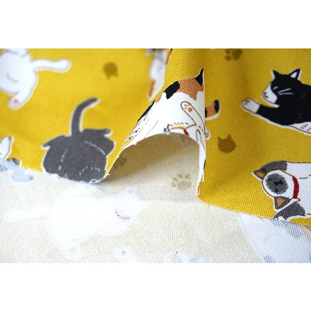 オックス 生地 ゴロにゃんこ へそ出しニャンコ 猫柄 肉球 綿100％ 布