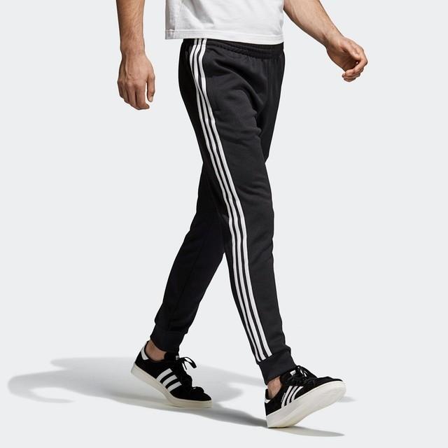adidas　フィットネスパンツ　ブラック　ロゴ　ポケット　ポリエステル　ワイド adidas（アディダス）の「M ID クォーターニット ジョガーパンツ