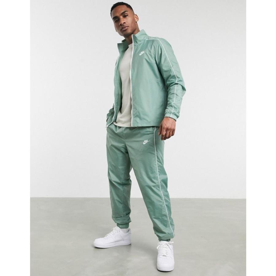 nike woven tracksuit green