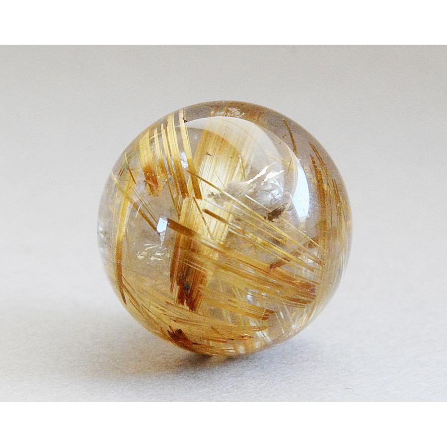 ゴールデンルチルクリスタル　丸玉 ゴールドルチル入り水晶丸玉20.0ミリ クォーツ CR52