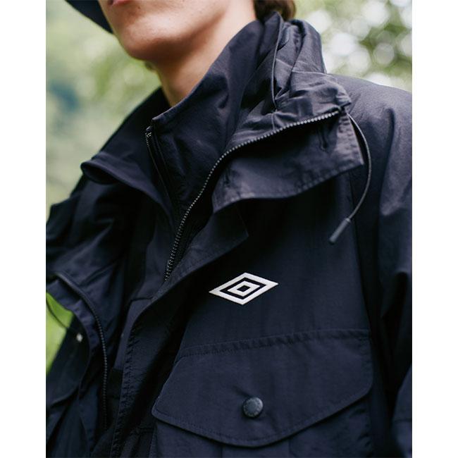 [SALE] White Mountaineering × UMBRO ホワイトマウンテニアリング アンブロ スタンドカラー ラグランミドル マルチポケットコート WM2573222 メンズの画像